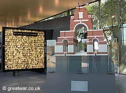 Inside the Thiepval Visitor Centre, with (left) the photographic panel of 600 of the Missing of the Somme and (right) Lutyens' scale model for the memorial.