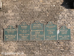 Signs to British and Commonwealth cemeteries.